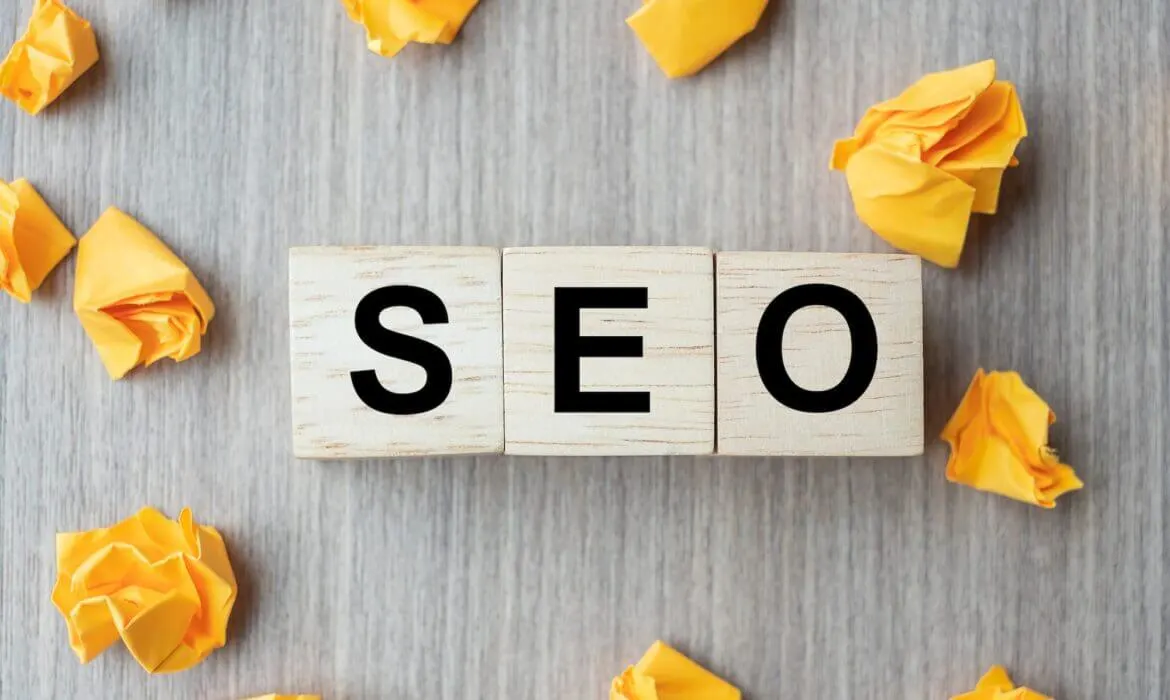 Blog 42 Wooden blocks spelling SEO with crumpled yellow paper around.